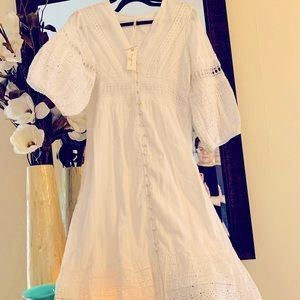 So Feminine and beautiful mid length white Dress